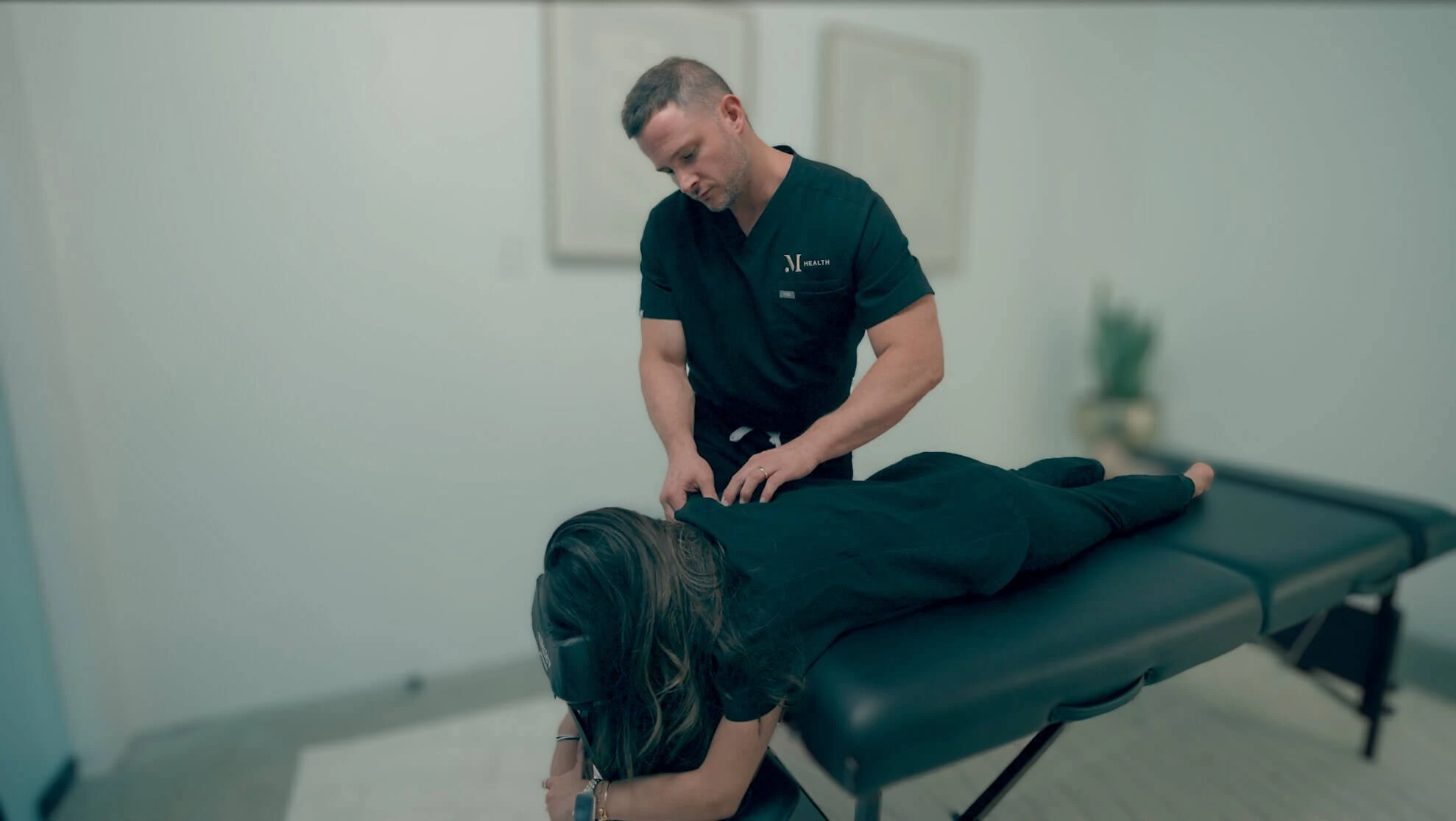 M Health specialist performing a bodywork and movement restoration session